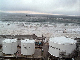 TEPCO releases photos of tsunami hitting plant