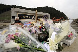 Flowers and tributes in front of Okawa Elementary School in Ishinomaki