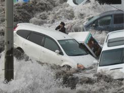 Reporter is swept away by tsunami in port city of Kamaishi