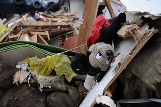 Mickey Mouse doll lies among debris in Ofunato