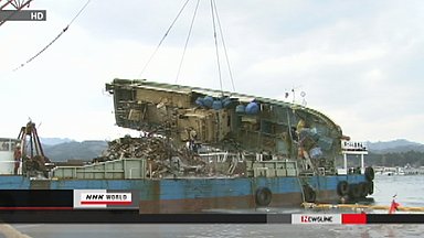 Work begins to remove boats sunk by tsunami