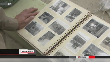 Volunteers clean photos found in Japan tsunami debris