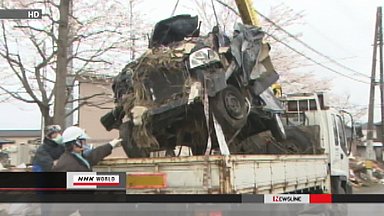 Wrecked cars removed from Sendai residential area