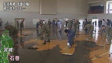 U.S. troops help teens clean tsunami hit school