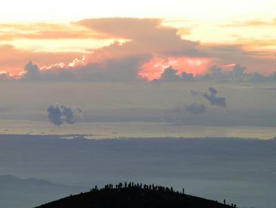 Hikers awaiting sunrise on the eastern rim of the caldera